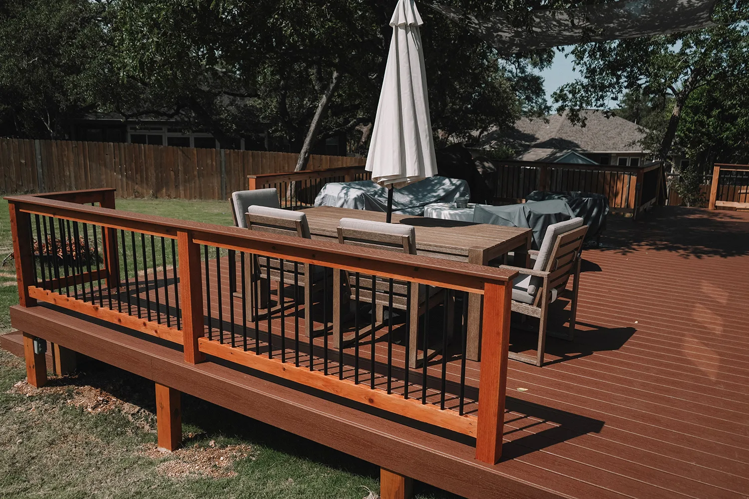 Beautiful deck construction with railings and outdoor furniture